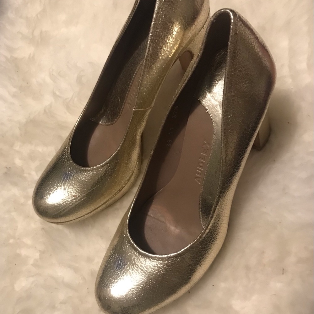 Gold high heel shoes